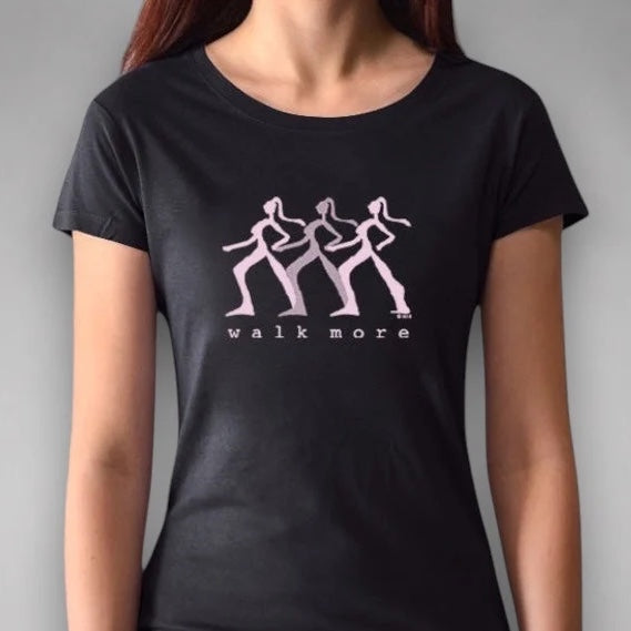 Black Women's Walking T-Shirt in Bamboo & Organic Cotton worn by model, featuring pink 'Walk More' print. Stylish sustainable fitness tee.