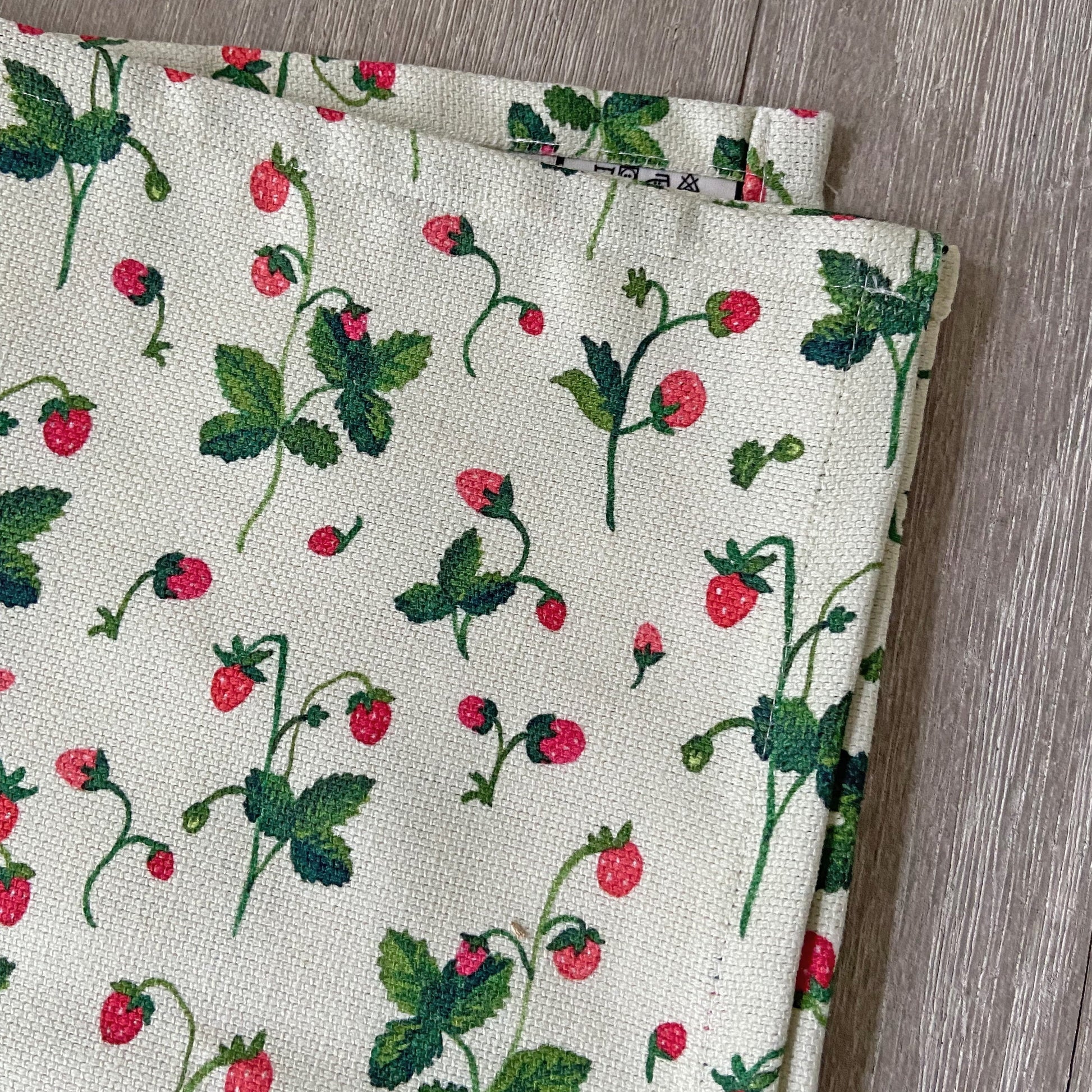 Tea set with strawberry design on table