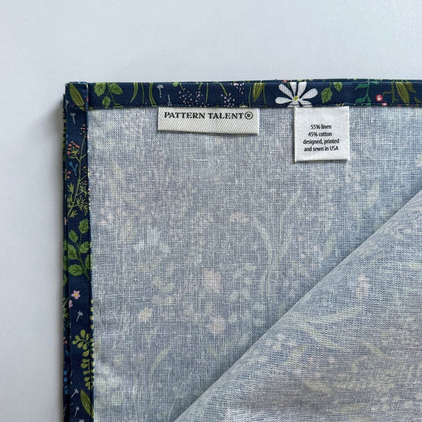 Navy botanical fabric napkin with floral design