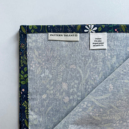 Navy botanical fabric napkin with floral design