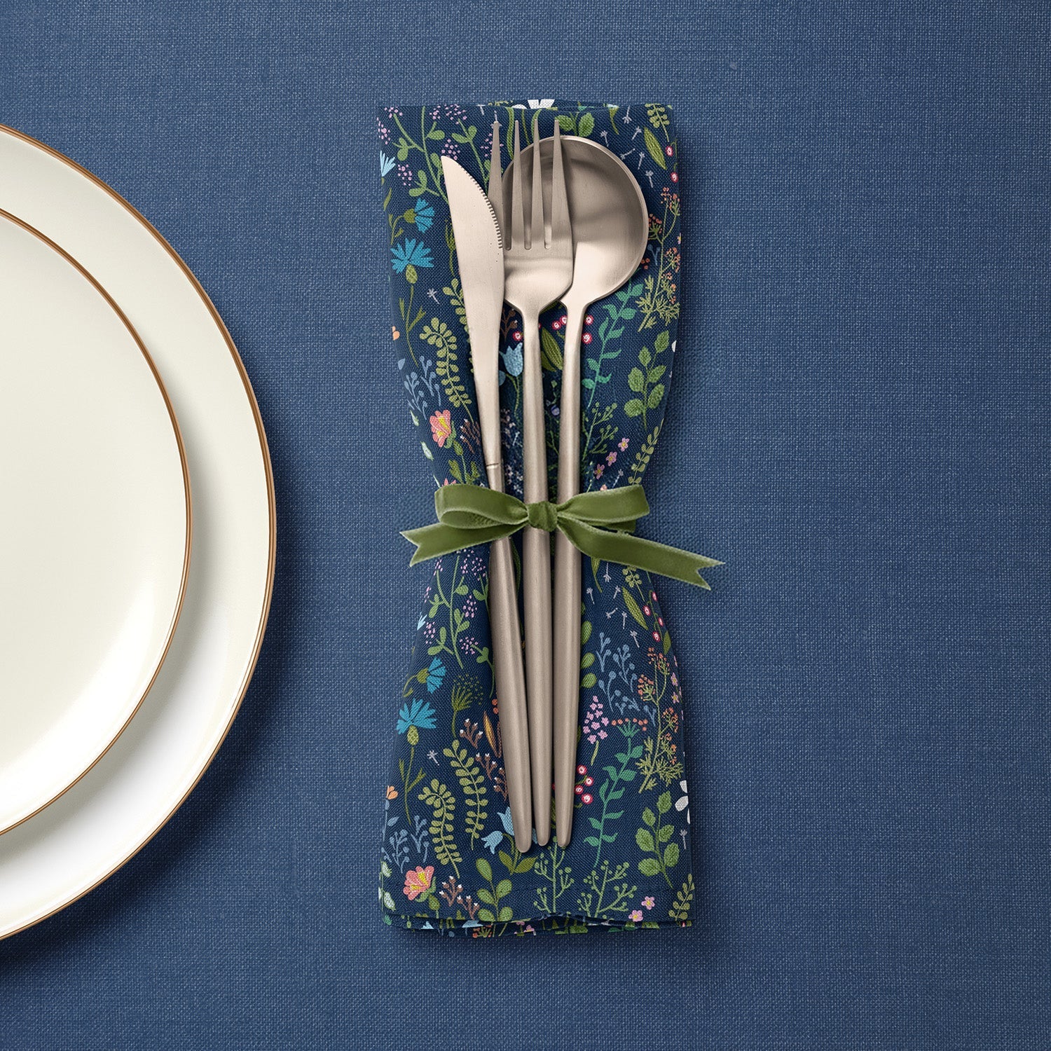 Navy floral fabric napkin with cutlery