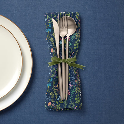 Navy floral fabric napkin with cutlery