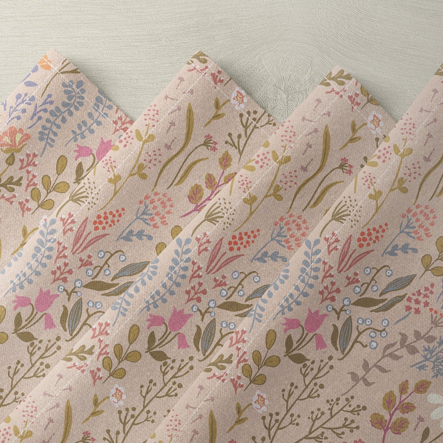 Floral linen napkin with pink, blue, and beige botanical print