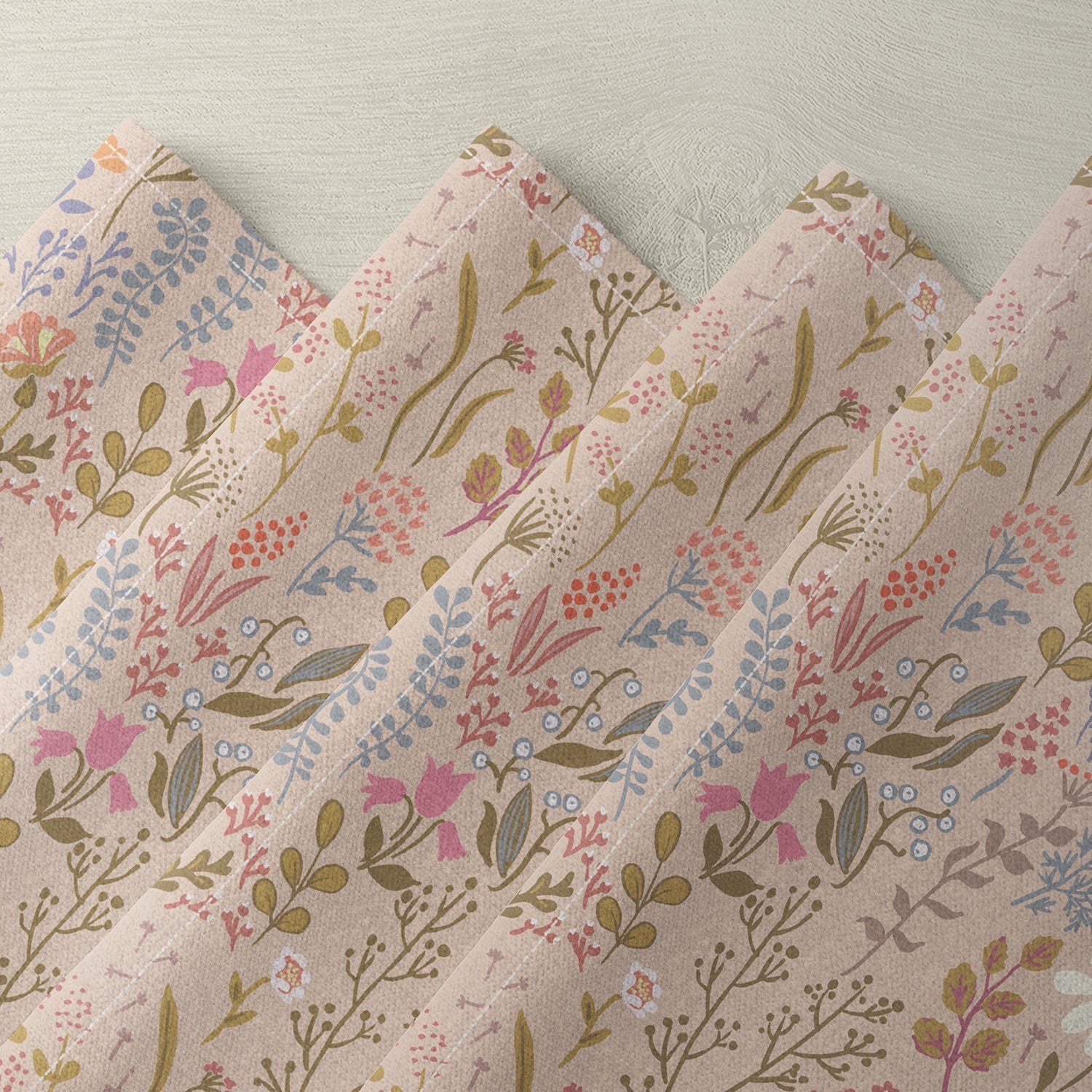 Floral linen napkin with pink, blue, and beige botanical print