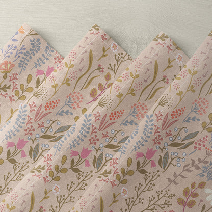 Floral linen napkin with pink, blue, and beige botanical print