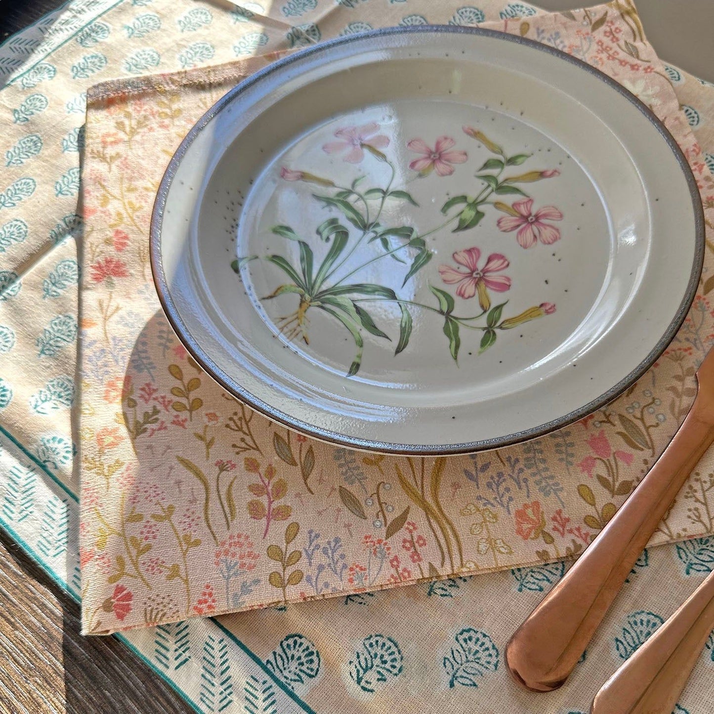 Decorative floral dinner plate with pink and green accents