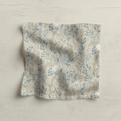 Floral patterned fabric napkin on light wood surface