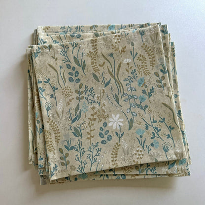 Glass with floral fabric napkin inside