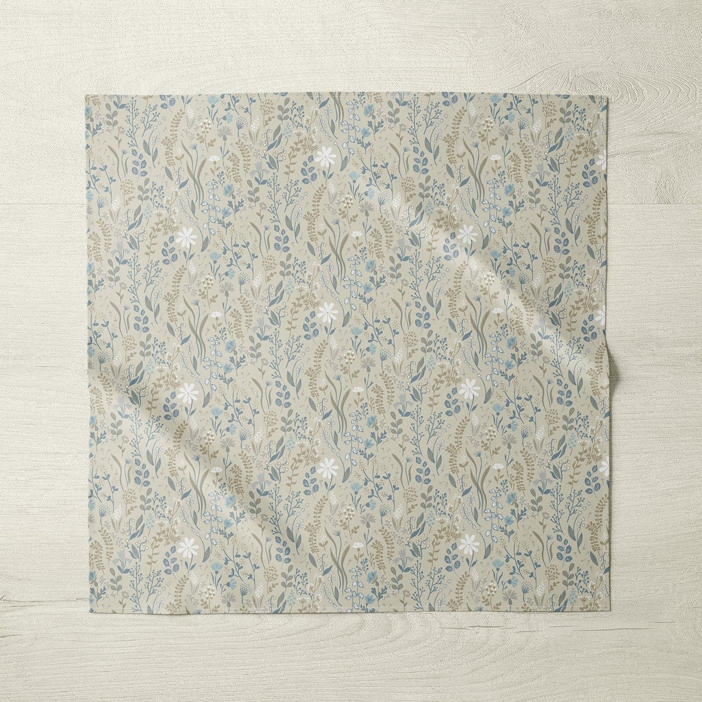 Stacked floral fabric napkins on white background