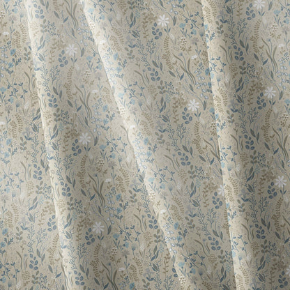 Close-up of beige floral fabric napkin with blue and white botanical print