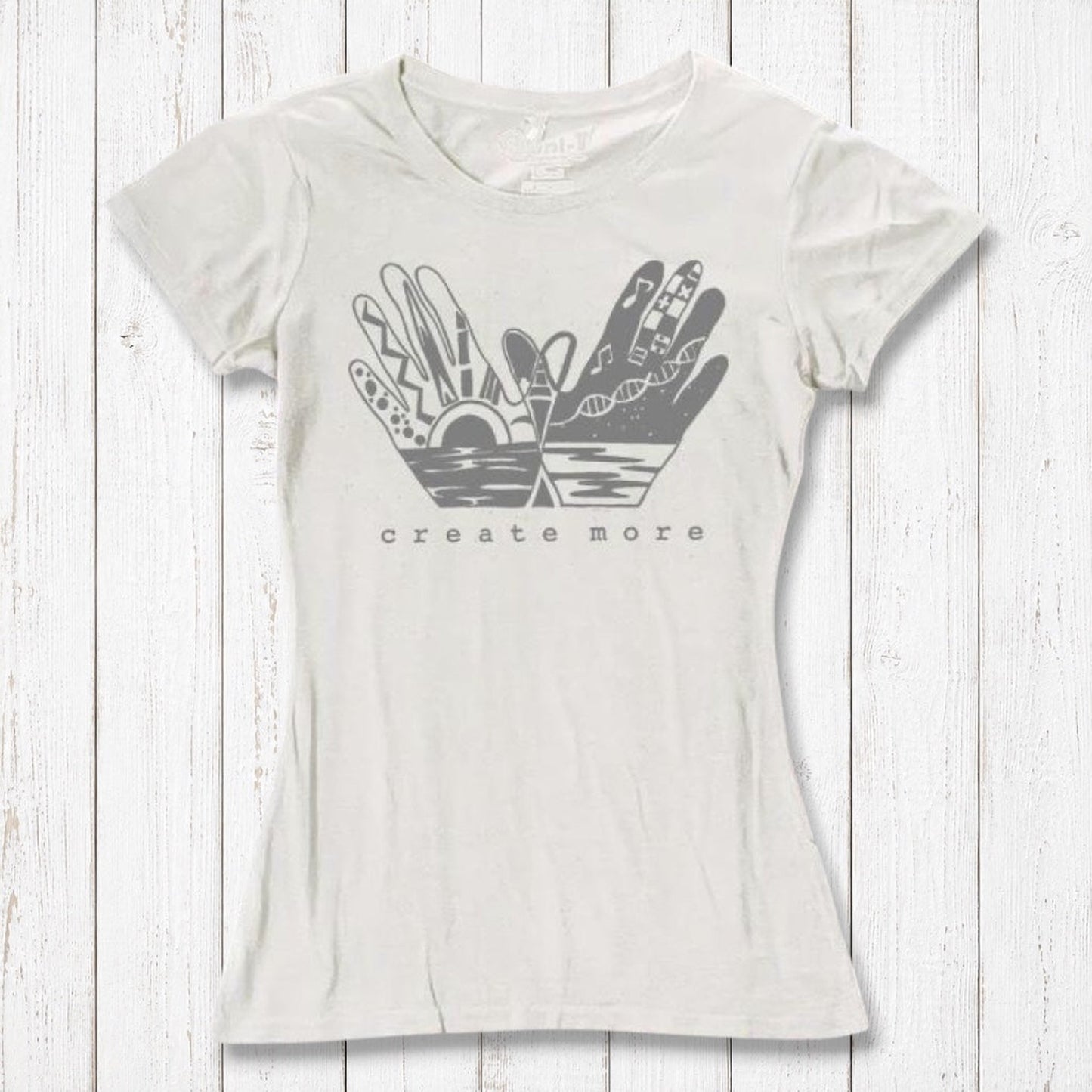 Ivory white Women's Bamboo & Organic Cotton Tee with 'Create More' artistic hands graphic. Ethical fashion top for artists and creatives.