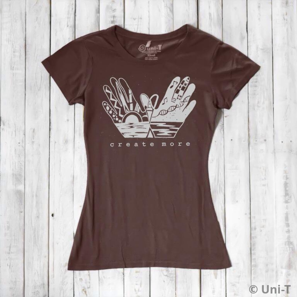 Chocolate brown Women's Eco-Friendly Graphic Tee with 'Create More' hand design. Organic cotton and bamboo blend for artistic expression.