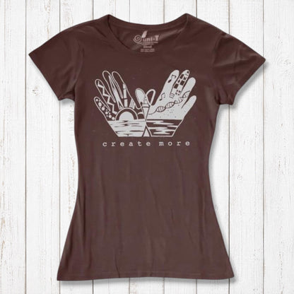 Chocolate brown Women's Eco-Friendly Graphic Tee with 'Create More' hand design. Organic cotton and bamboo blend for artistic expression.