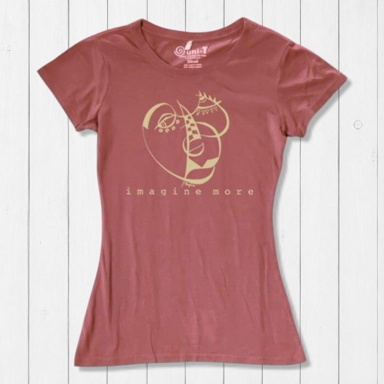 Rust red Women's Cubism Face T-Shirt in bamboo & organic cotton with abstract gold face print and 'imagine more' text. Unique gift for creatives.