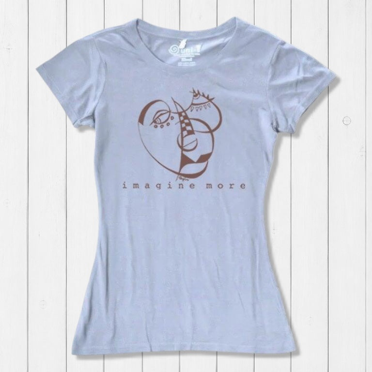 Light blue Women's Cubism Face T-Shirt in bamboo & organic cotton with brown abstract face design and 'imagine more' text. Artistic eco-friendly top.
