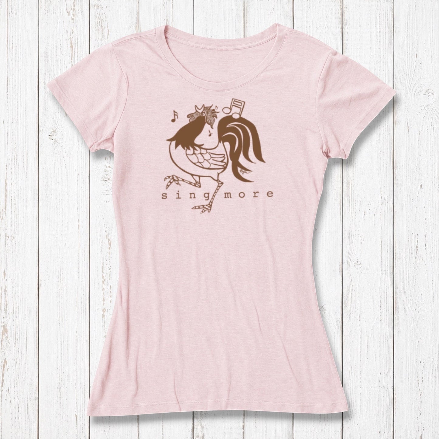 Light pink women's T-shirt made of bamboo and organic cotton with a playful rooster graphic singing with musical notes, casual wear