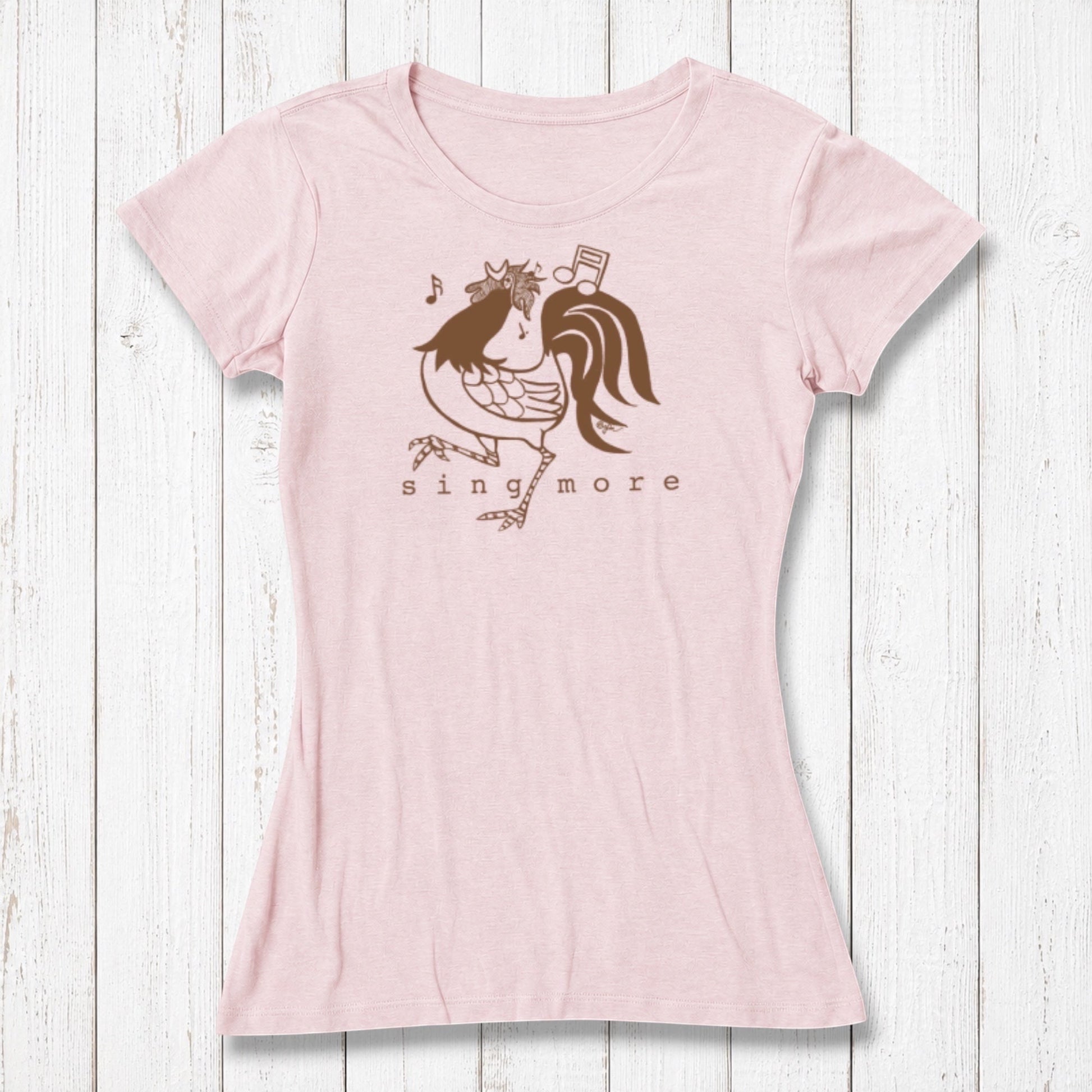 Light pink women's T-shirt made of bamboo and organic cotton with a playful rooster graphic singing with musical notes, casual wear