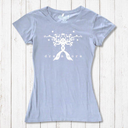 Light blue Women's Motivational T-Shirt in Bamboo & Organic Cotton with white 'Dream More' tree design, laid flat on wooden surface.