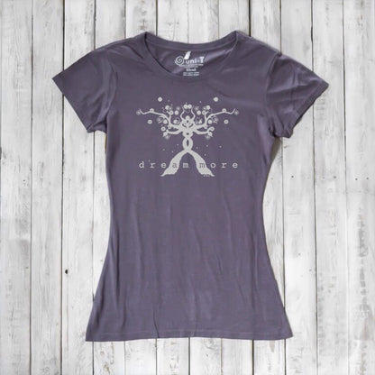 Charcoal gray Women's Motivational T-Shirt in Bamboo & Organic Cotton with light 'Dream More' tree graphic, flat lay on wood background.