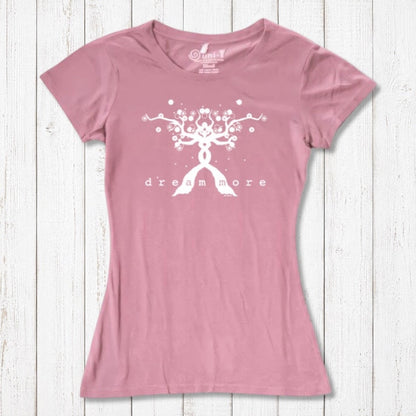 Pink Women's Motivational T-Shirt in Bamboo & Organic Cotton featuring white 'Dream More' tree graphic, laid flat on rustic wood.