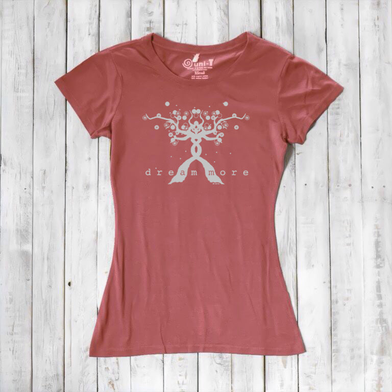 Terracotta Women's Motivational T-Shirt in Bamboo & Organic Cotton with light 'Dream More' tree design, flat lay on wood background.