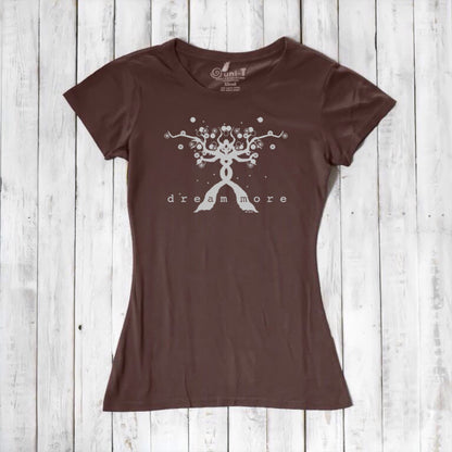 Brown Women's Motivational T-Shirt in Bamboo & Organic Cotton with subtle 'Dream More' tree graphic, displayed flat on wooden surface.