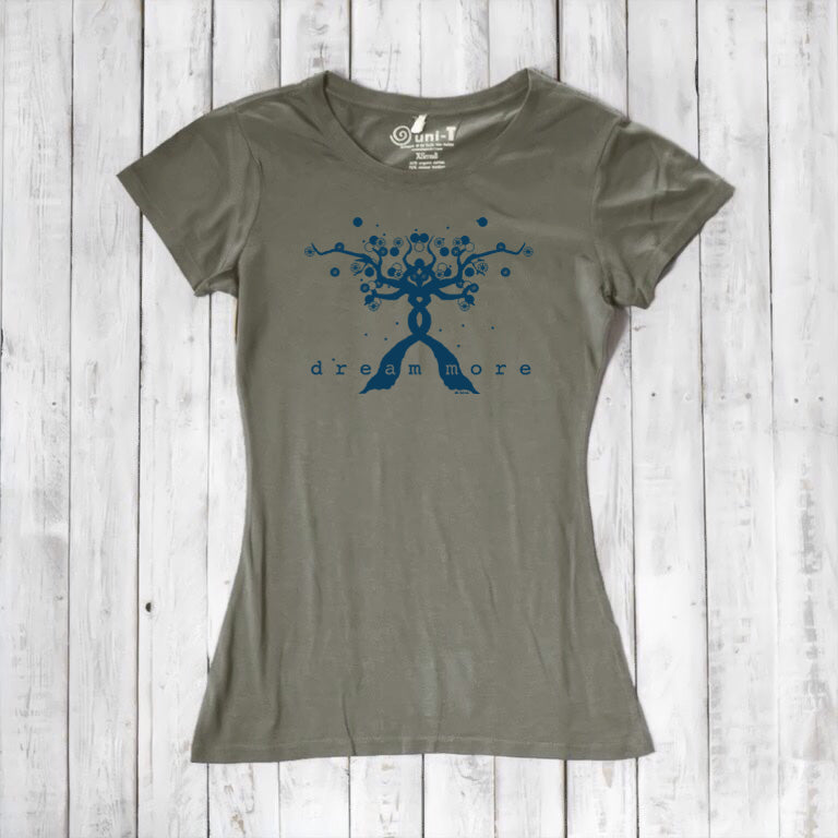 Olive green Women's Motivational T-Shirt in Bamboo & Organic Cotton with blue 'Dream More' tree graphic, flat lay on rustic wood.