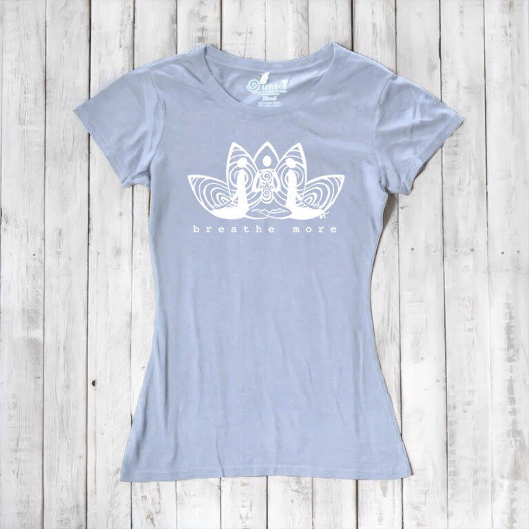 Light blue Women's Yoga T-Shirt in Bamboo & Organic Cotton with 'Breathe More' lotus design, sustainable and inspirational yoga apparel.