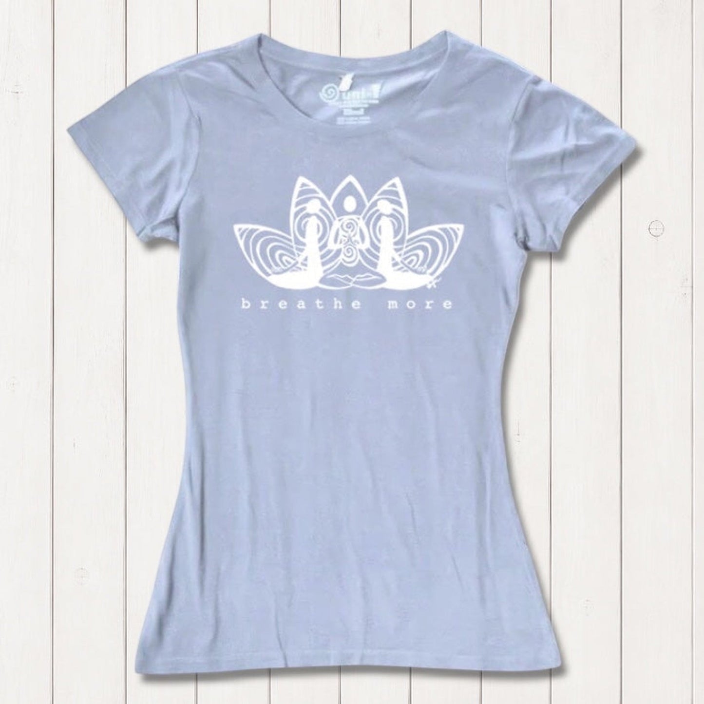 Light blue Women's Yoga T-Shirt in Bamboo & Organic Cotton with 'Breathe More' lotus design, sustainable and inspirational yoga apparel.