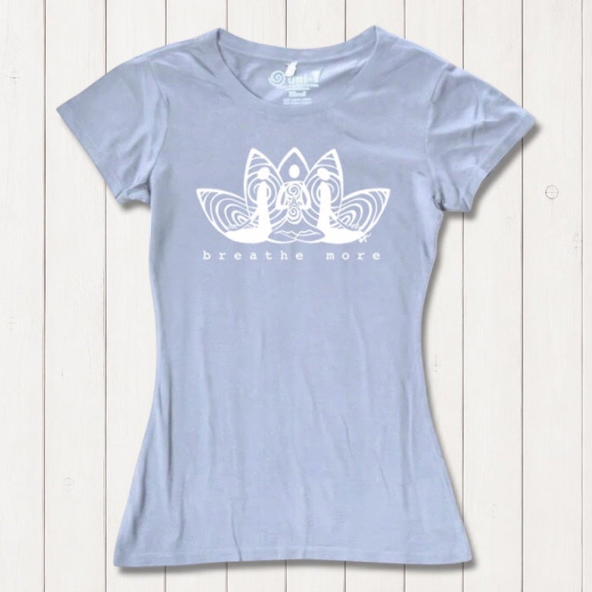 Light blue Women's Yoga T-Shirt in Bamboo & Organic Cotton with 'Breathe More' lotus design, sustainable and inspirational yoga apparel.