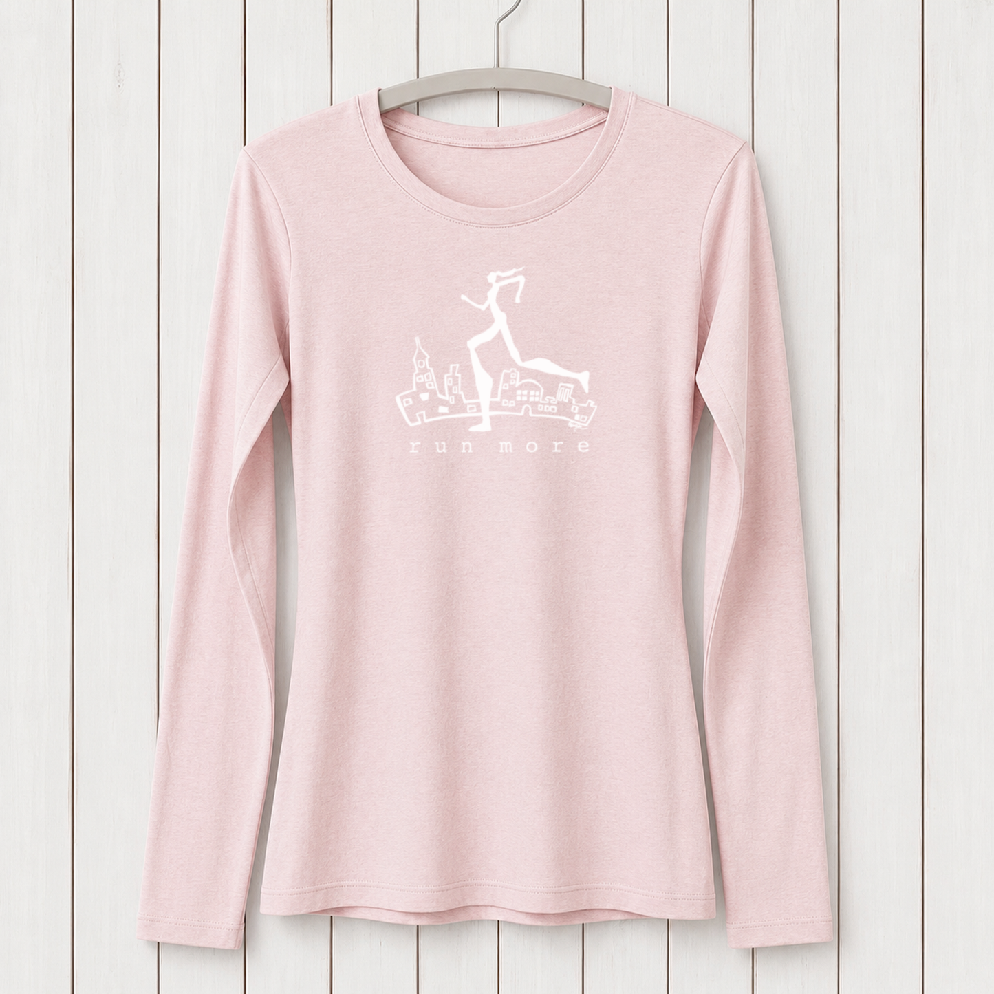 Light pink women's long sleeve T-shirt made from bamboo and organic cotton with a white graphic of a running woman and cityscape, perfect for activewear and running fitness.