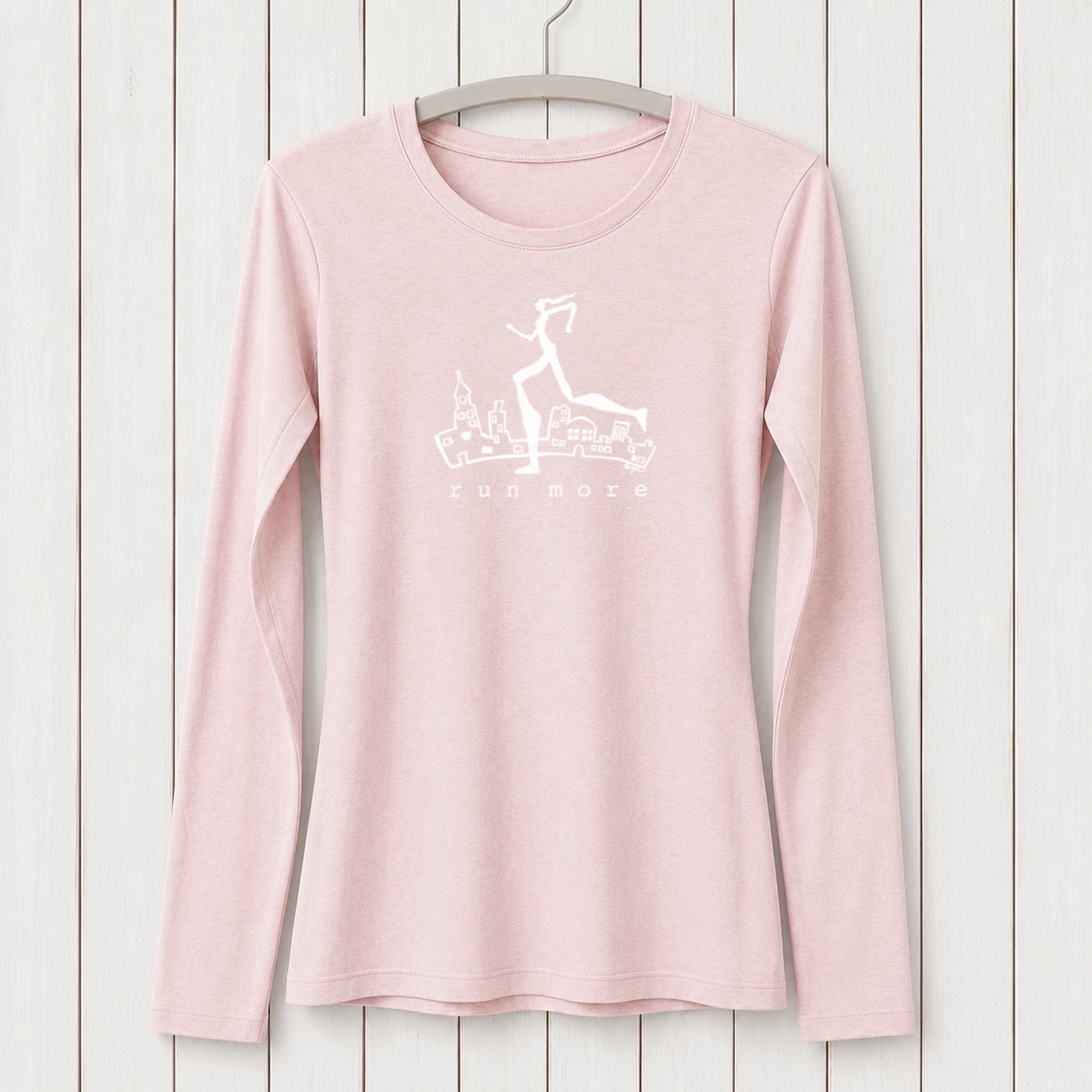 Light pink women's long sleeve T-shirt made from bamboo and organic cotton with a white graphic of a running woman and cityscape, perfect for activewear and running fitness.
