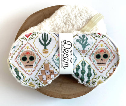 Sweet Dreams Sleep Mask - Frida White Print featuring colorful sugar skulls and cacti on soft cotton with plush minky backing, ideal for restful sleep.