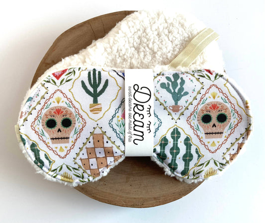 Sweet Dreams Sleep Mask - Frida White Print featuring colorful sugar skulls and cacti on soft cotton with plush minky backing, ideal for restful sleep.