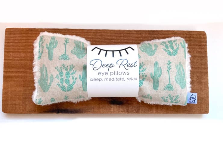 Cactus-themed Deep Rest Eye Pillow on wooden board, designed for weighted relaxation and soothing stress relief.