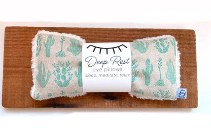 Cactus-themed Deep Rest Eye Pillow on wooden board, designed for weighted relaxation and soothing stress relief.