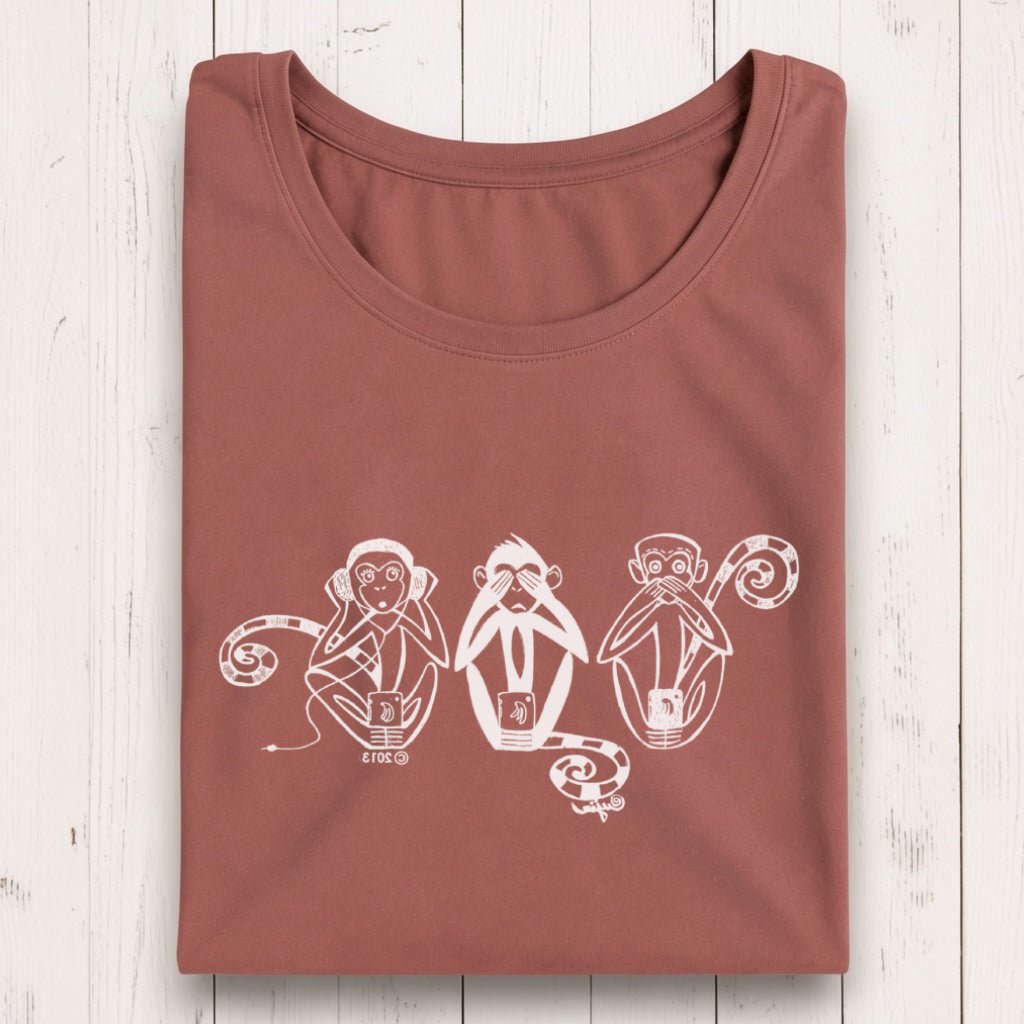 Rust-colored women's long sleeve T-shirt with white graphic of three wise monkeys covering ears, eyes, and mouth, made from bamboo organic cotton.