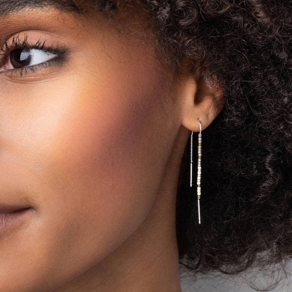 Model wearing Miyuki Thread Earring - Dark Multi Gold, highlighting its elegant drop and colorful bead accents for a chic, hypoallergenic style.