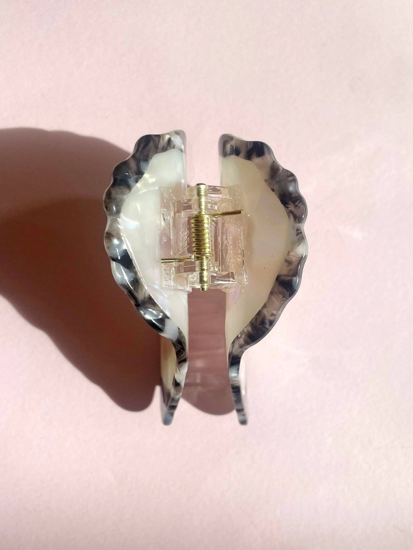 Close-up of Line&Co Oyster Claw Clip hinge mechanism. Durable and stylish hair accessory with a secure grip and pearl embellishment.