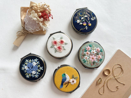 Set of 5 Floral Embroidered Jewelry Boxes - Round & Mirror | 3 Compartments, featuring various floral and bird designs for stylish storage.