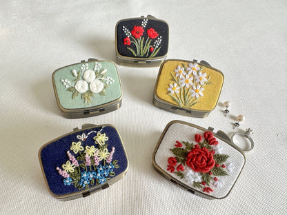 Floral Embroidered Jewelry Box - Elegant Storage in five unique floral designs, perfect for organizing rings and earrings in a compact, stylish case.