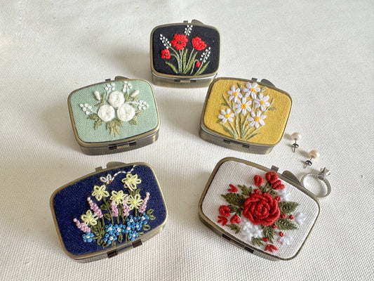 Floral Embroidered Jewelry Box - Elegant Storage in five unique floral designs, perfect for organizing rings and earrings in a compact, stylish case.