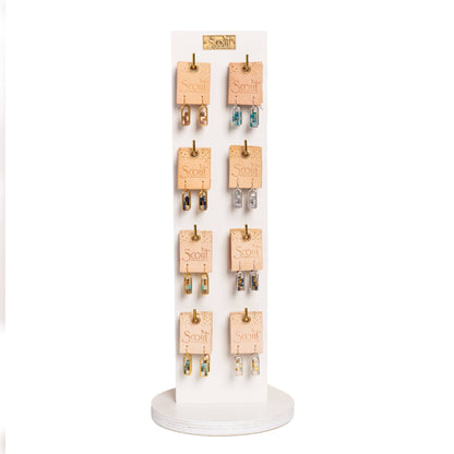 White vertical display stand showcasing Miyuki Frame Earrings - Indigo/Gold and other styles, designed for organized retail merchandising.