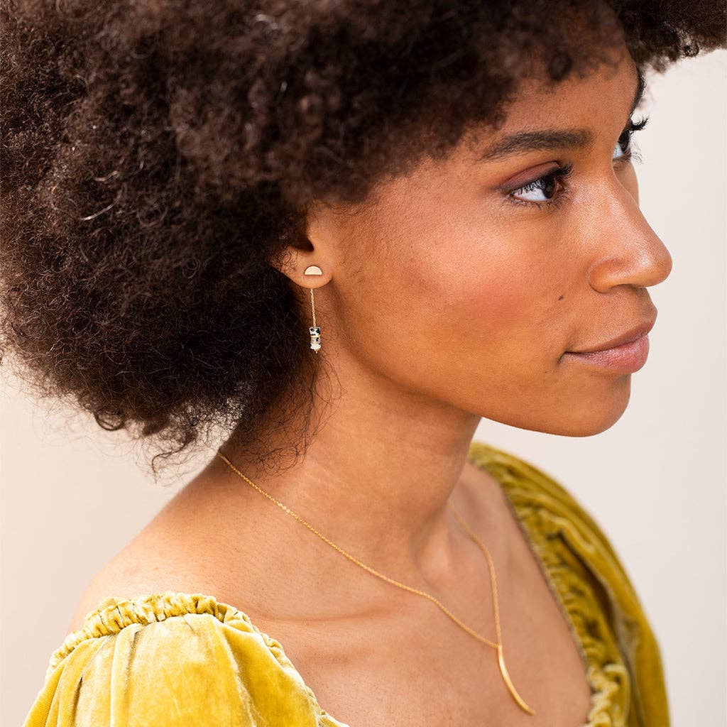 Model wearing Lapis Stone Earrings - Meteor Thread with minimalistic 1.5'' drop design, showcasing hypoallergenic silver chain and lapis stones.
