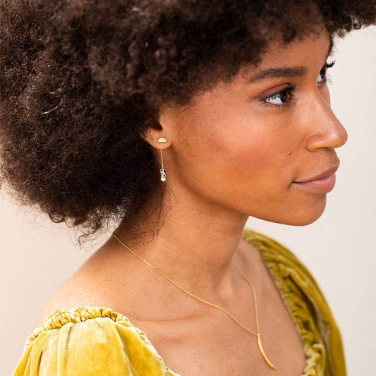 Model wearing Lapis Stone Earrings - Meteor Thread with minimalistic 1.5'' drop design, showcasing hypoallergenic silver chain and lapis stones.