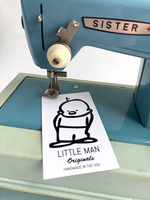 Cute cartoon bear tag on sewing machine