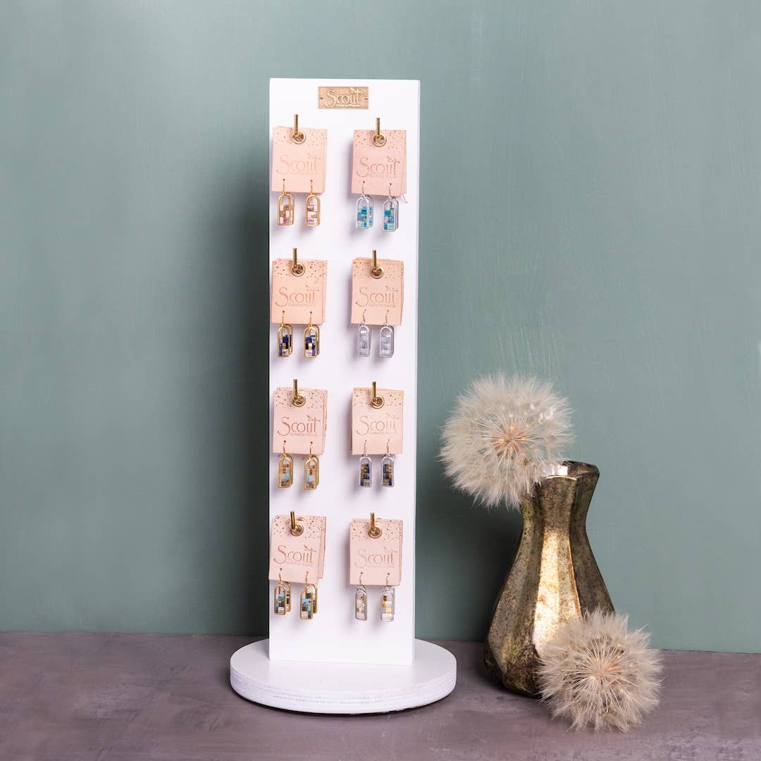 Retail display stand featuring Miyuki Frame Earrings - Indigo/Gold among other color variants, ideal for boutique jewelry presentation.