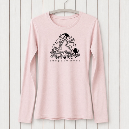 Light pink women's long sleeve T-shirt made from bamboo and organic cotton with a black graphic design featuring a star, waves, and clouds, and the text 'recycle more' underneath, hanging on a white wooden wall.