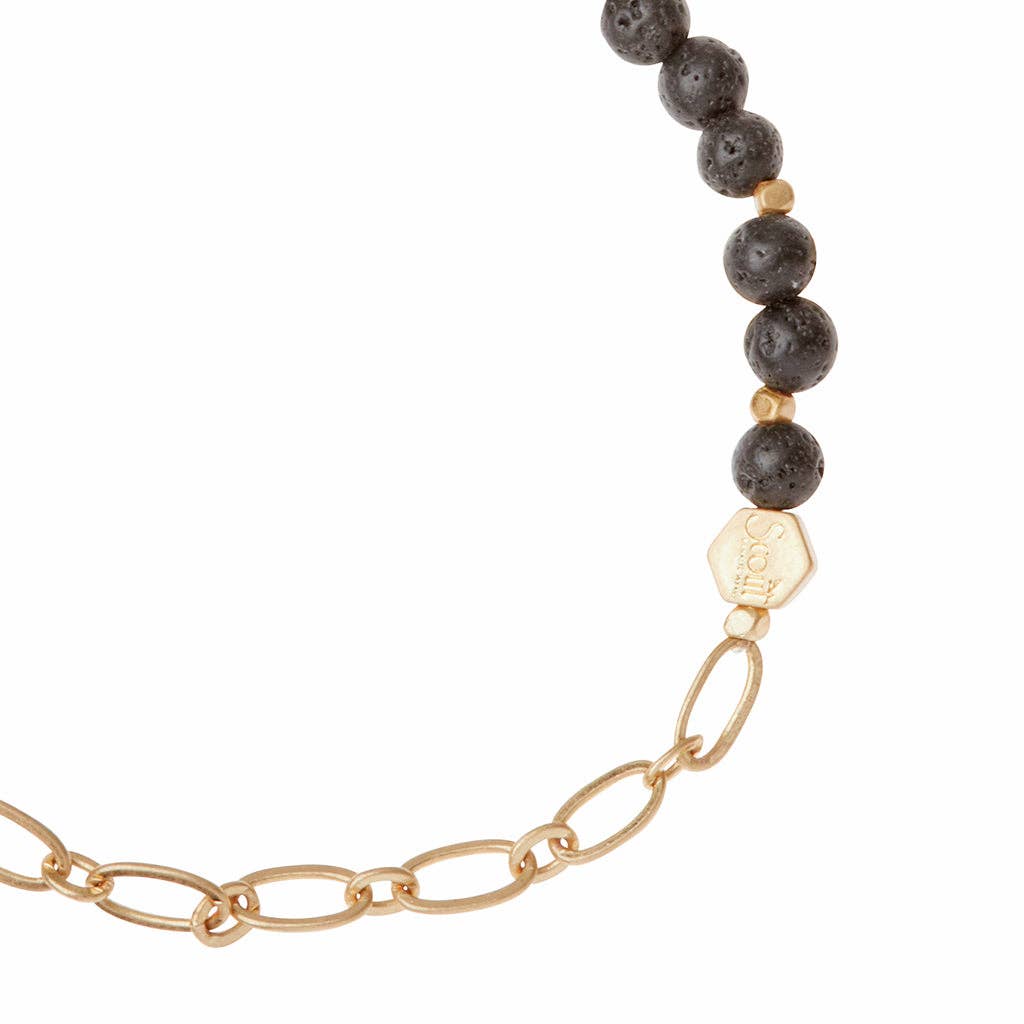Close-up of Lava Stone Bracelet with Chain - Strength | Modern Design showing textured black lava stones and polished gold chain detail.