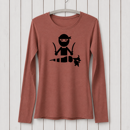 Rust-colored long sleeve T-shirt with a black graphic of a ninja character holding a carrot, made from bamboo organic cotton, displayed on a white hanger against a wooden background.